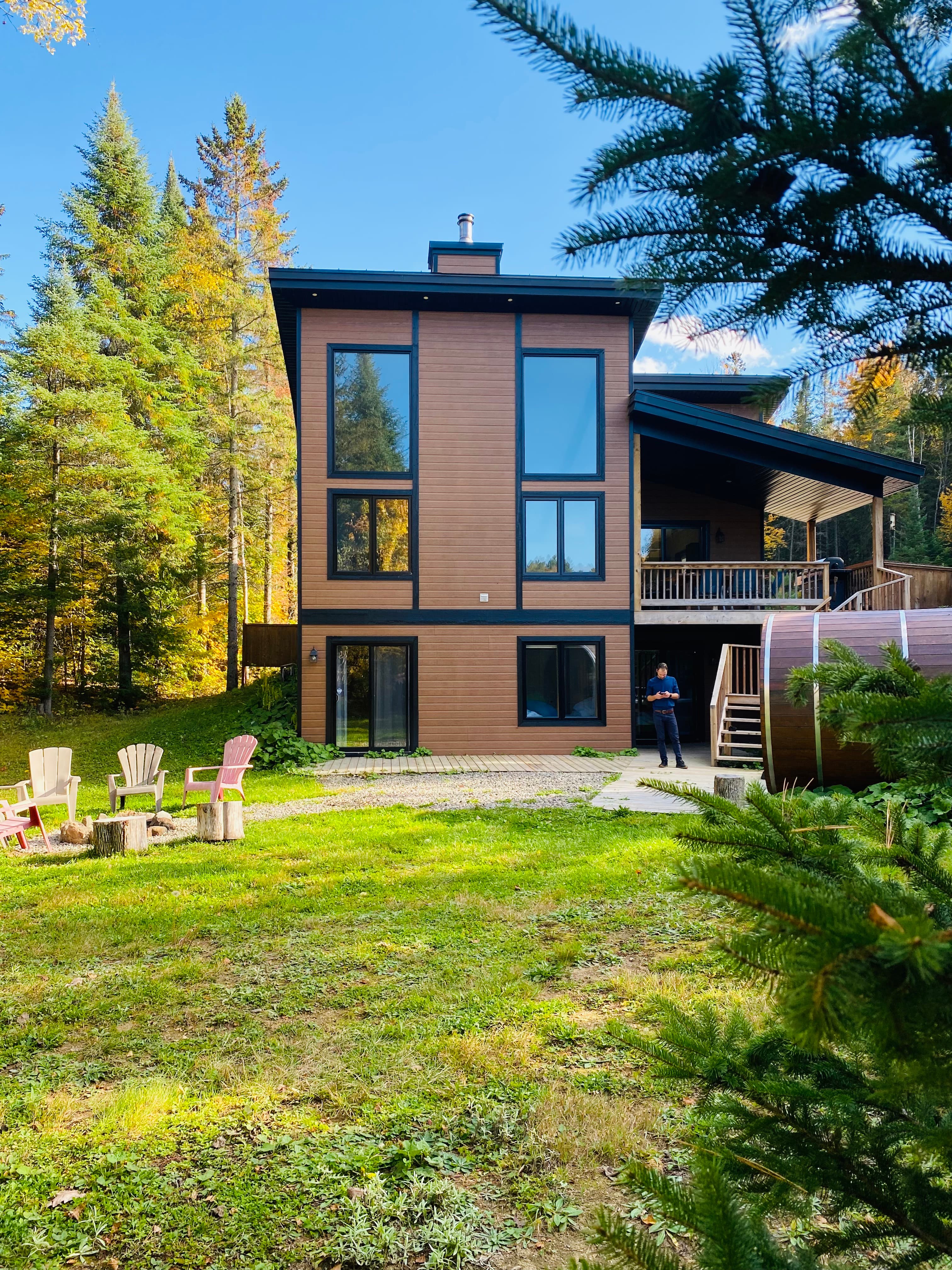 Chalet exterior surrounded by autumn foliage