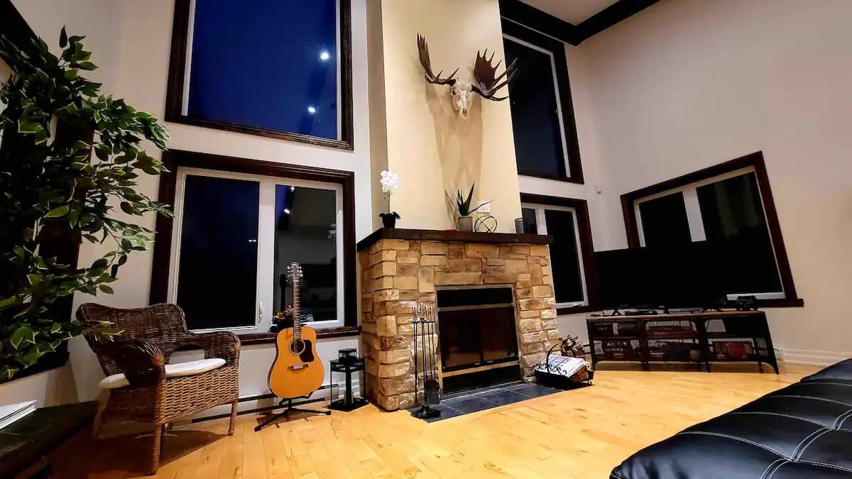 Living room with stone fireplace at night