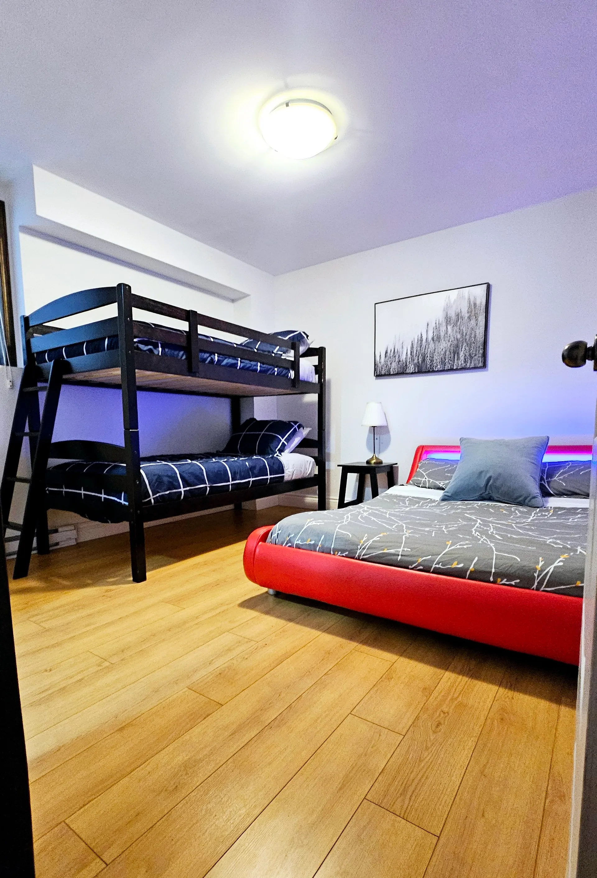 Third bedroom with queen bed and bunk beds